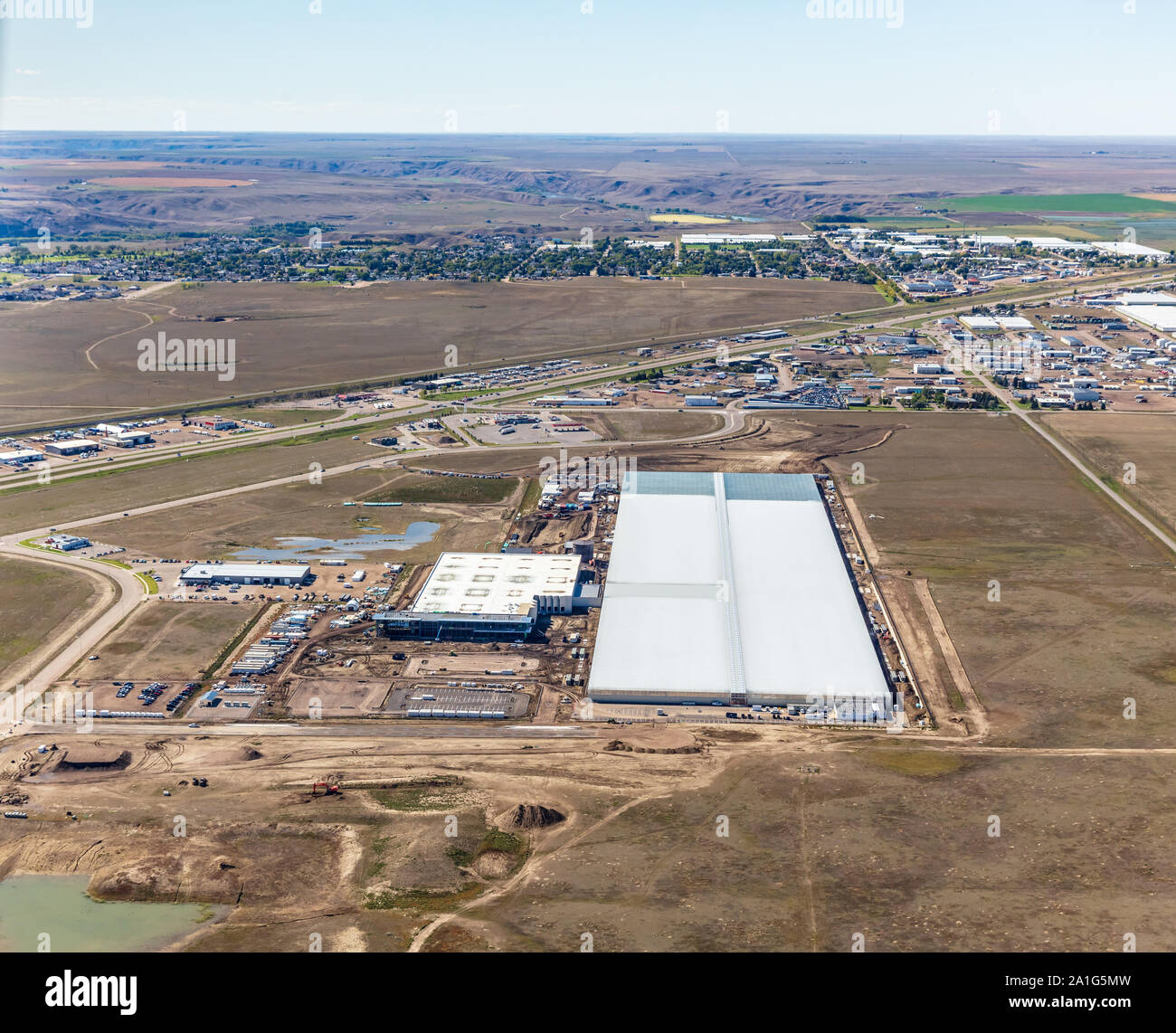 Aerial photo of Aurora Sun, a massive cannabis or marijuana greenhouse operation under construction in Box Springs Business Park at Medicine Hat, Albe Stock Photo