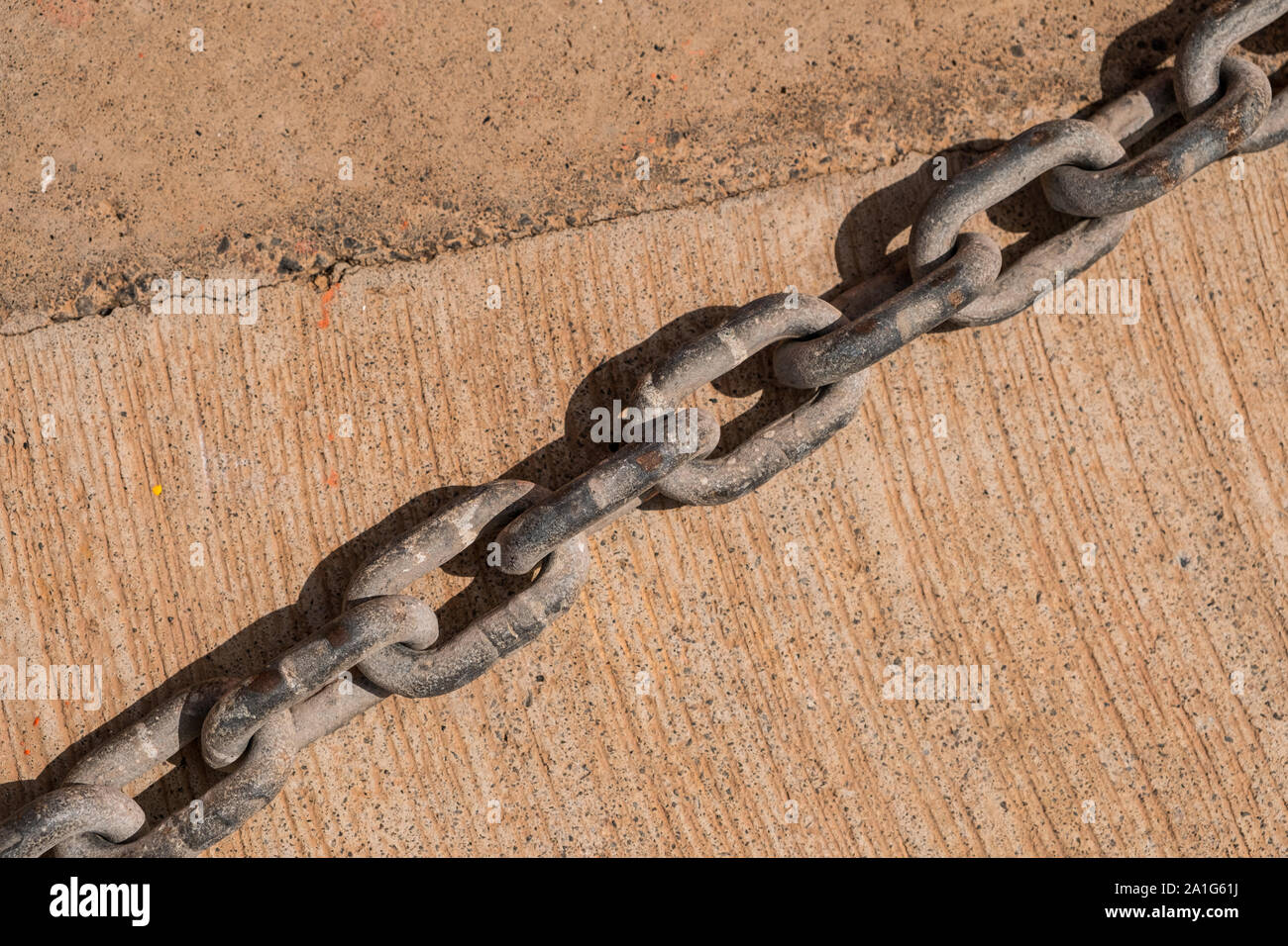 old rusty chain detail on floor Stock Photo