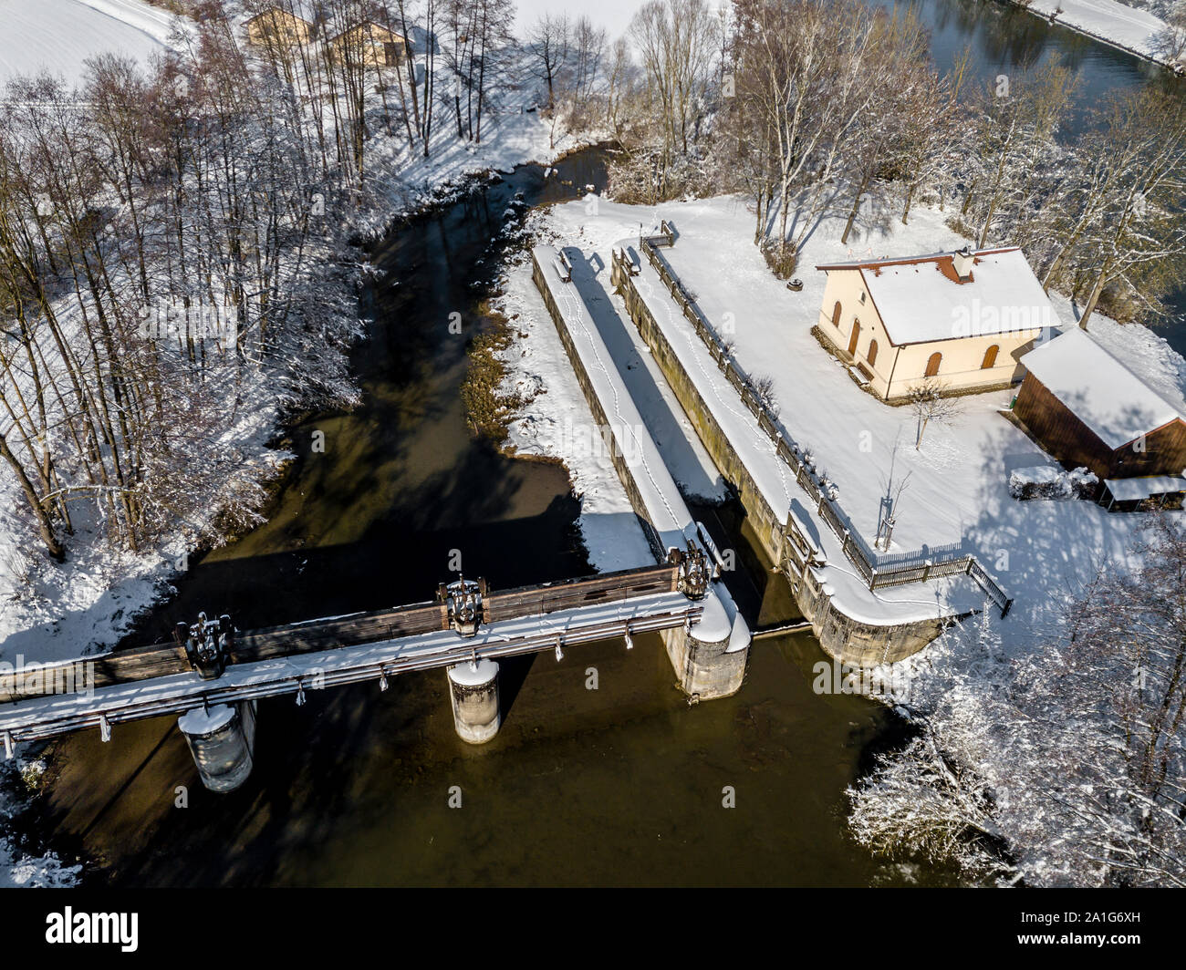 Historic lock house on the disused Ludwig-Danube-Main Canal near Meihern in the Altmühltal, Bavaria on a snowy, sunny day in winter Stock Photo