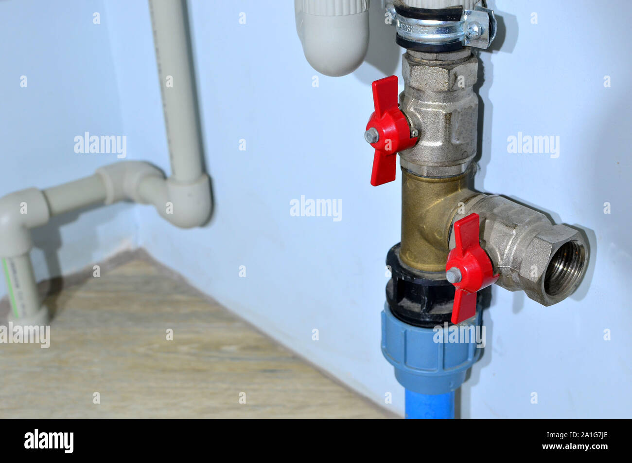 Piping and plumbing fitting in the home industry of the modern era.  Connecting pipe warm water floor to the manifold heating. Plumbing Pipes  and Fixt Stock Photo - Alamy