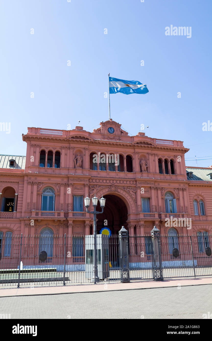 Argentine Government House, also called Casa Rosada by color, with the Argentina flag flying. Buenos Aires. Stock Photo