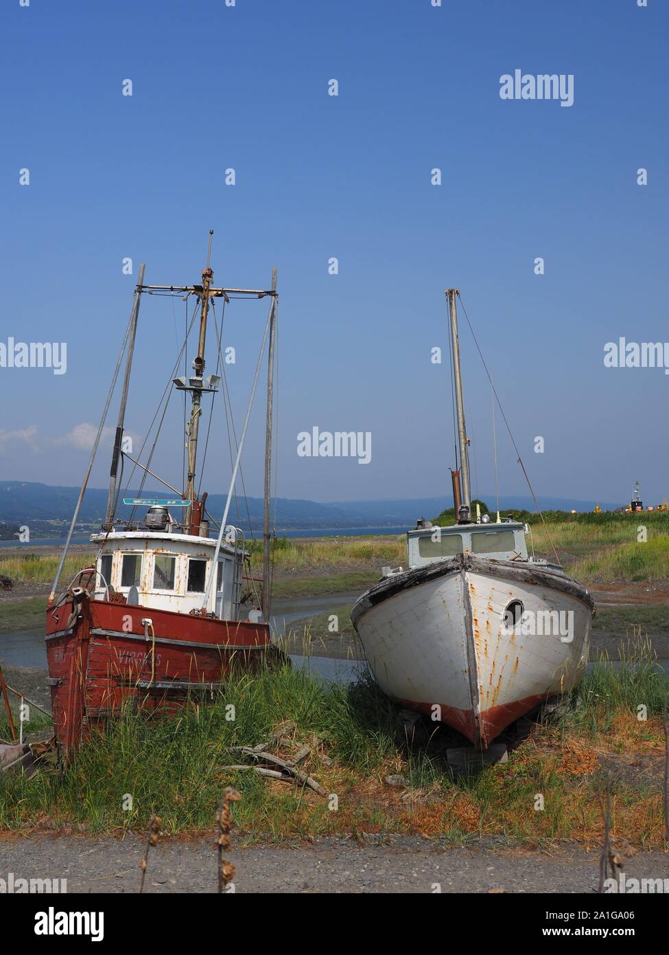 two beached derelict wrecked boats Homer Alaska USA Stock Photo