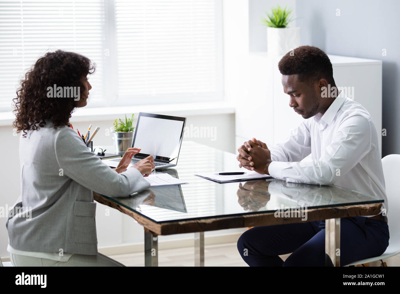 Stressed Young Business Man Failing Hard Interview In Office Stock Photo