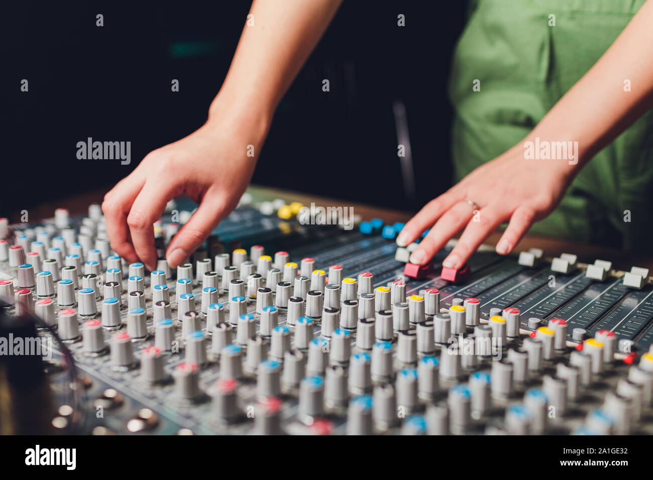 Recoding Mixing Engineer the mixer. remote for sound recording. sound engineer at work in the ...
