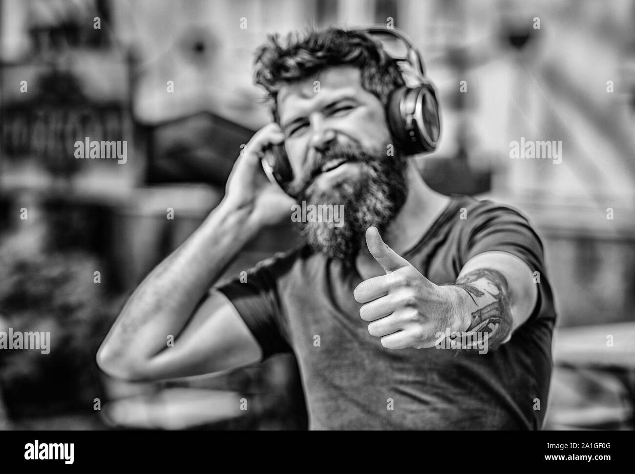 Music beat for energetic mood. Rhythm for walk. Excellent music playlist.  Man bearded hipster headphones listening music. Hipster enjoy excellent  sound song in earphones. Walking with music Stock Photo - Alamy