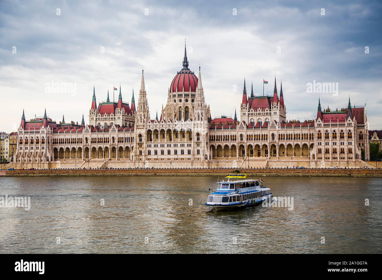 Danube, floating bus, pleasure boat and Hungarian Parliament from the opposite bank of the river. Budapest. Hungary Stock Photo