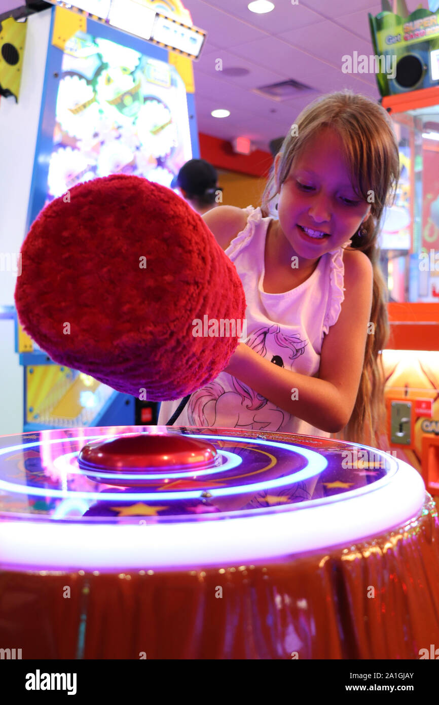 Child playing activity game at arcade Stock Photo