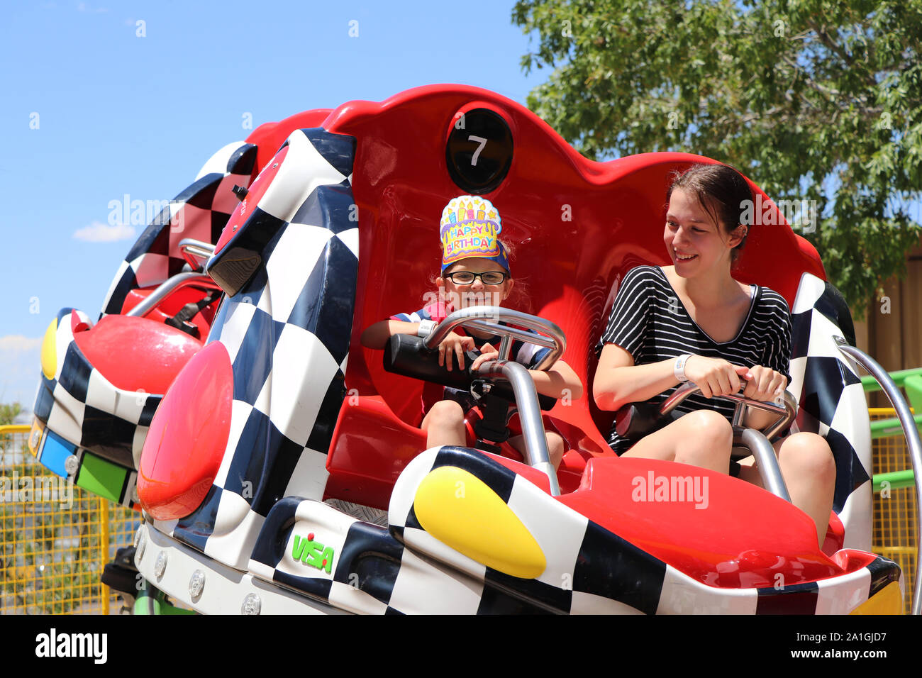 People taking a ride at the theme park Stock Photo