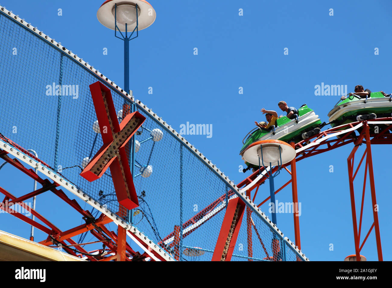 People riding a roller coaster Stock Photo - Alamy