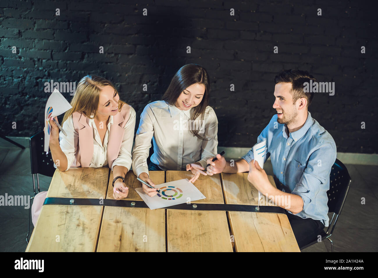 Good Work Discussions Young team of coworkers making great meeting discussion in modern ...