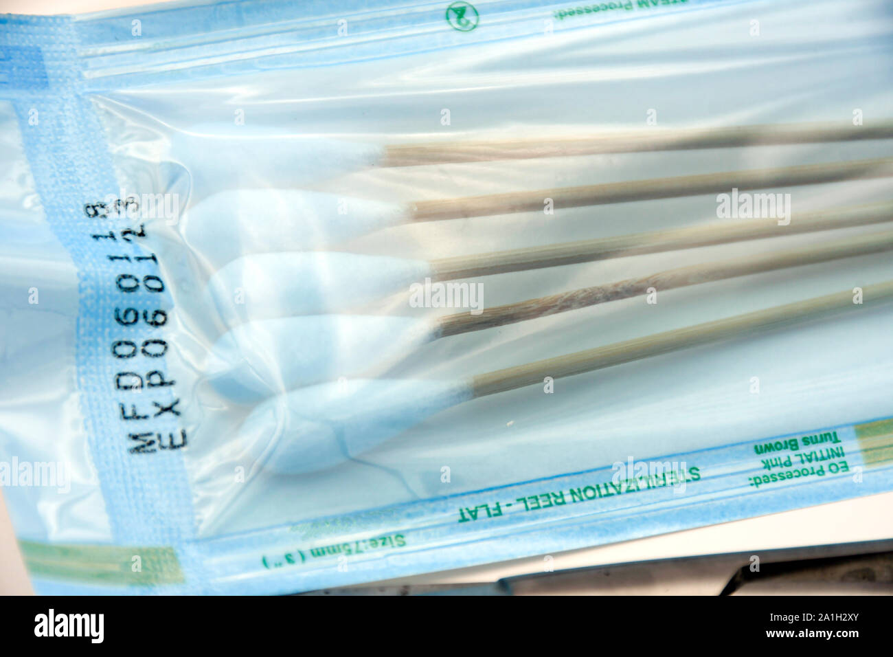 Sterile cotton swab in blue sterile pack with indicator, steriled by  ethylene oxide gas or EO Stock Photo - Alamy