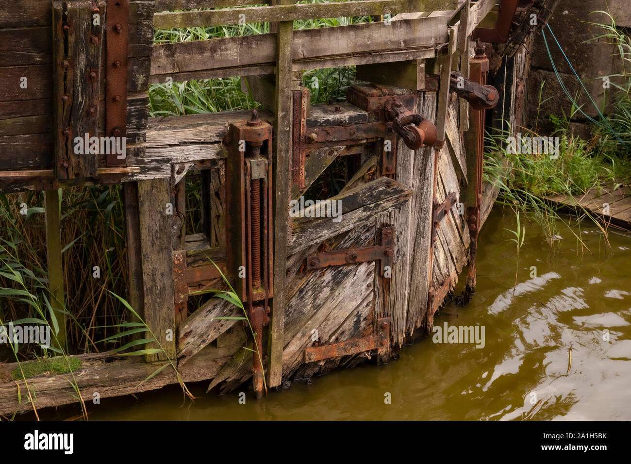 Broken old wooden lock gates at Pentewan, Cornwall Stock Photo