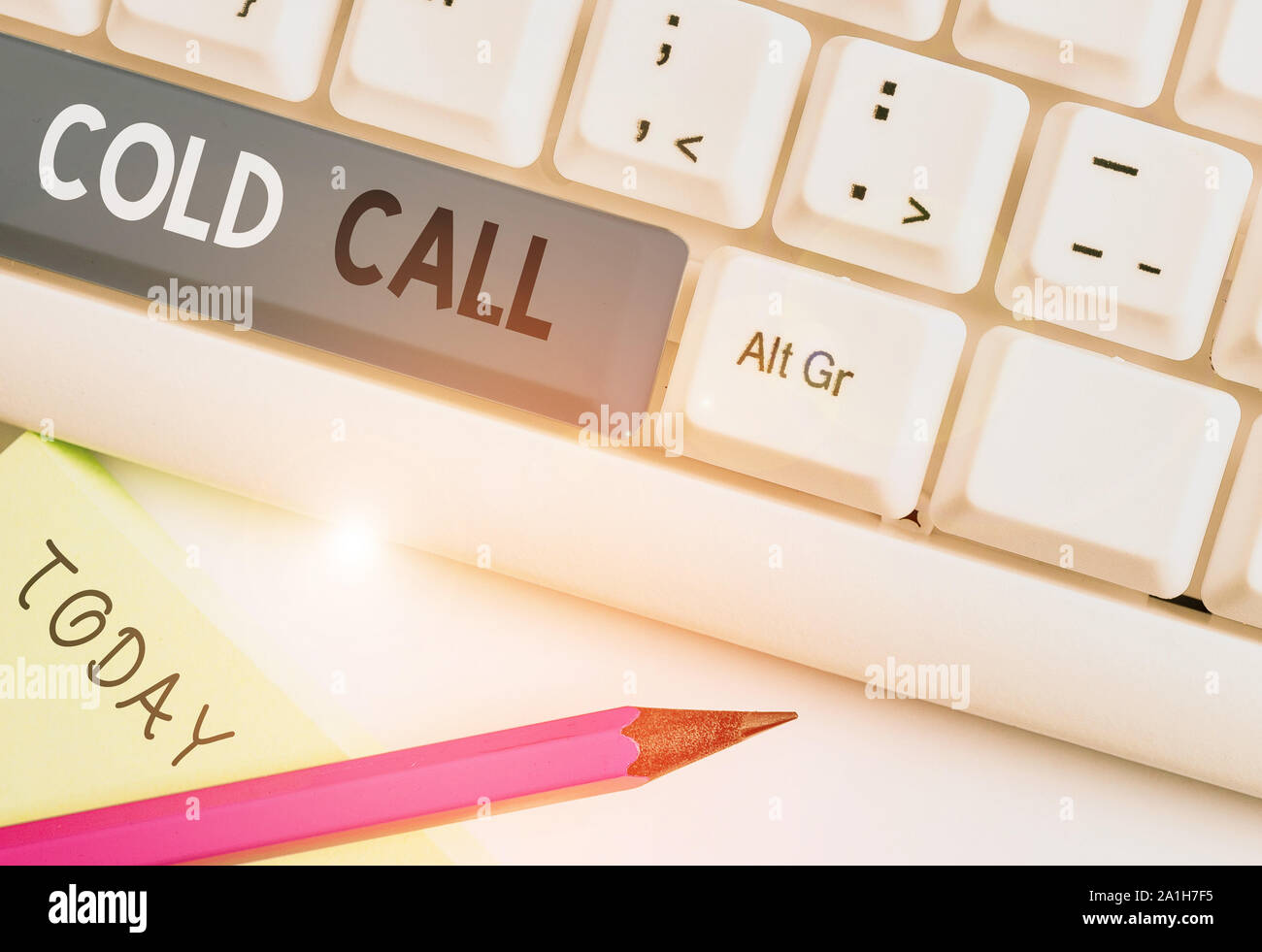 Writing note showing Cold Call. Business concept for Unsolicited call made by someone trying to sell goods or services White pc keyboard with note pap Stock Photo