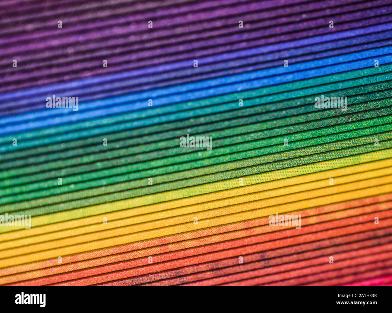 Brightly Colored Rainbow Paper  with Edges Creating Diagonal Pattern Stock Photo
