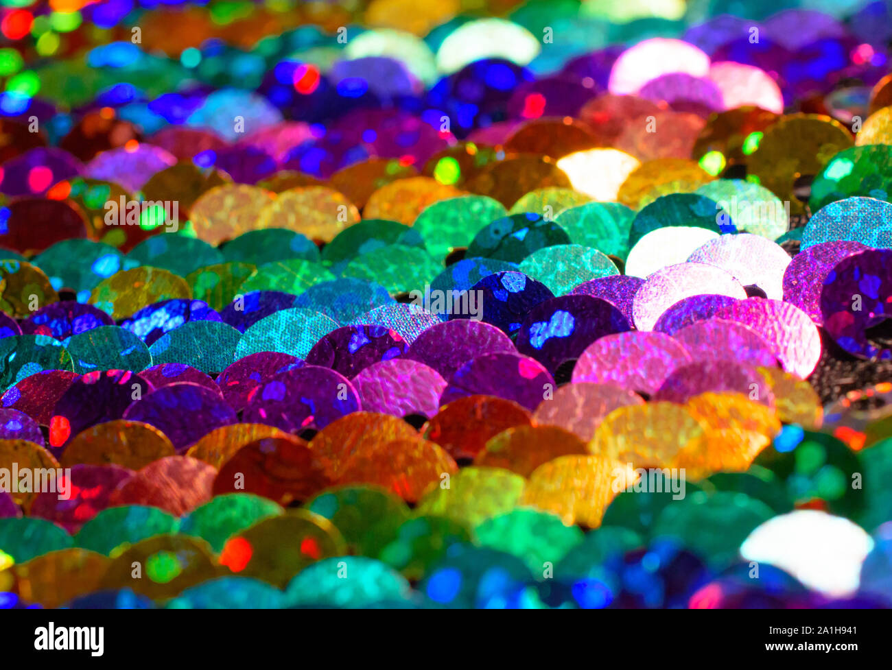 Closeup of Rainbow Colored Sparkly Sequins Stock Photo