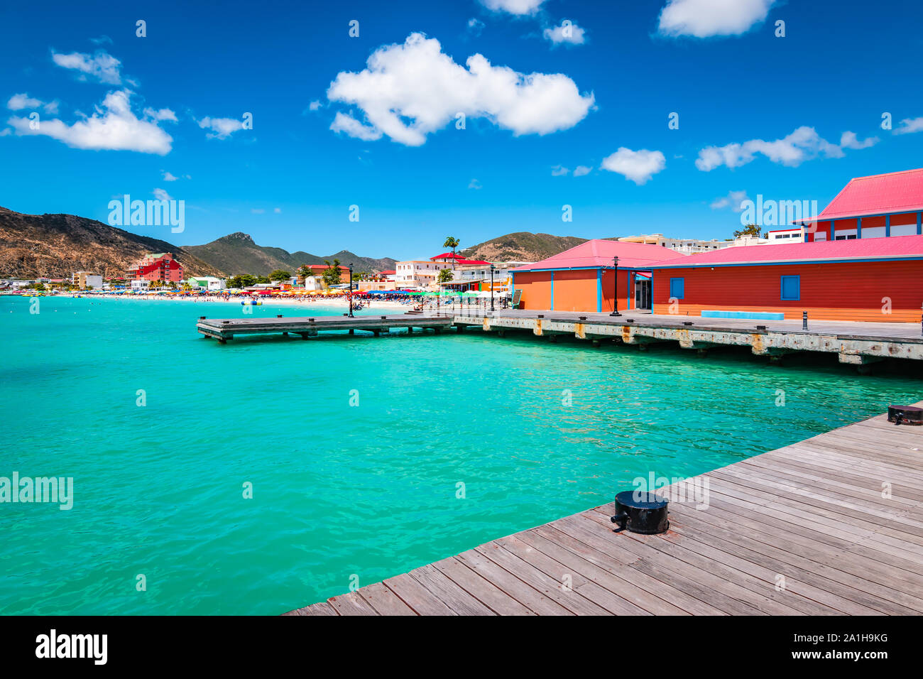 Philipsburg, St Maarten (Sint Maarten, Saint Martin), Caribbean. Wooden dock and colorful buildings at Great Bay beach. Popular cruise destination. Stock Photo