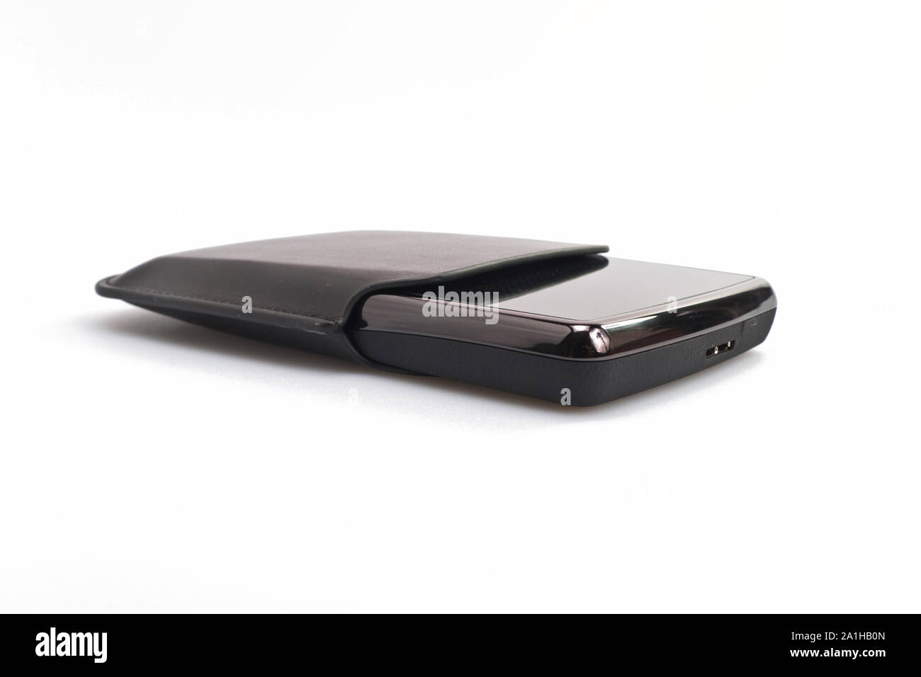 Black portable harddisk with soft leather case on white background Stock Photo