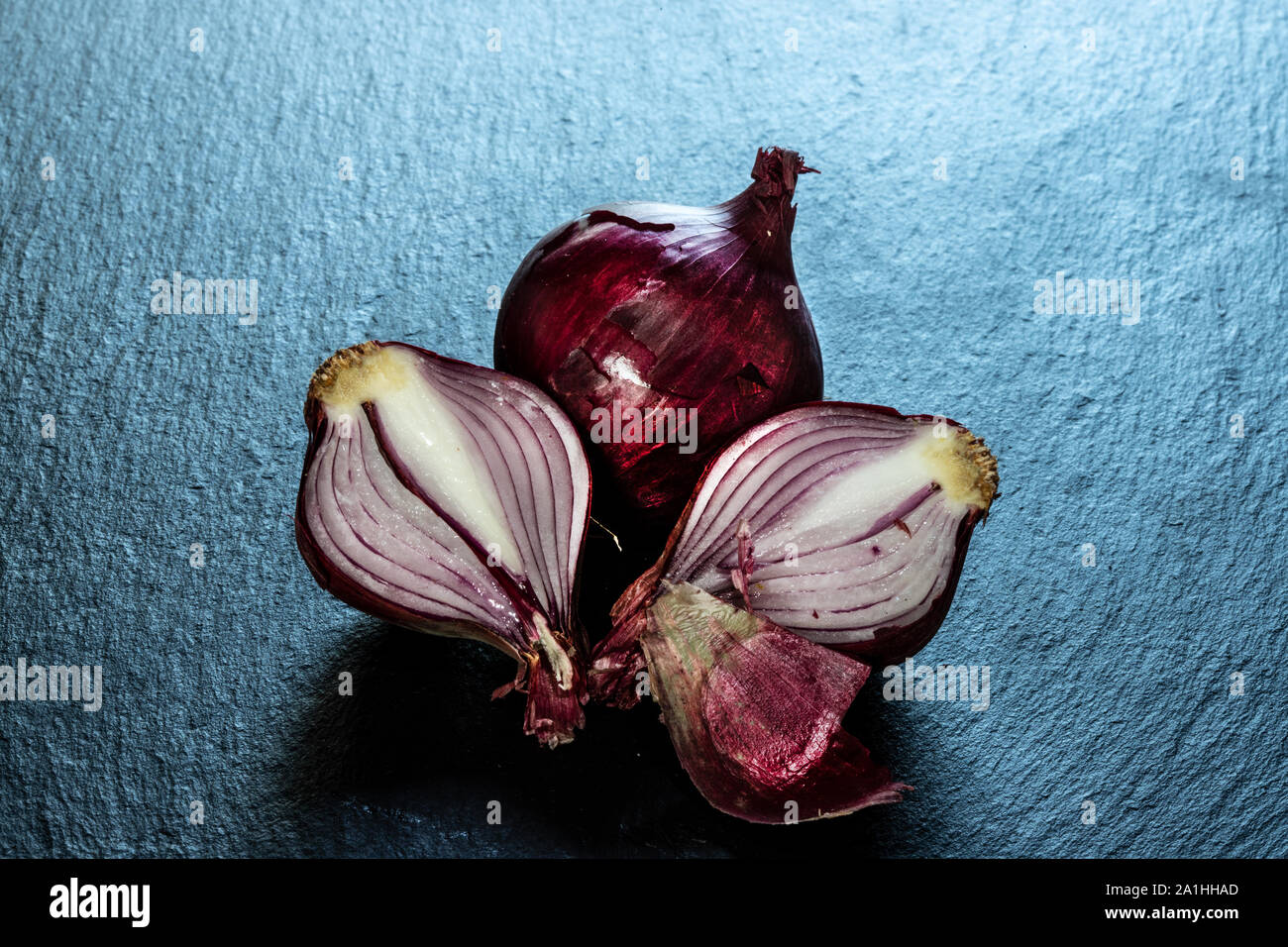 quarter red onions in peel Stock Photo Alamy