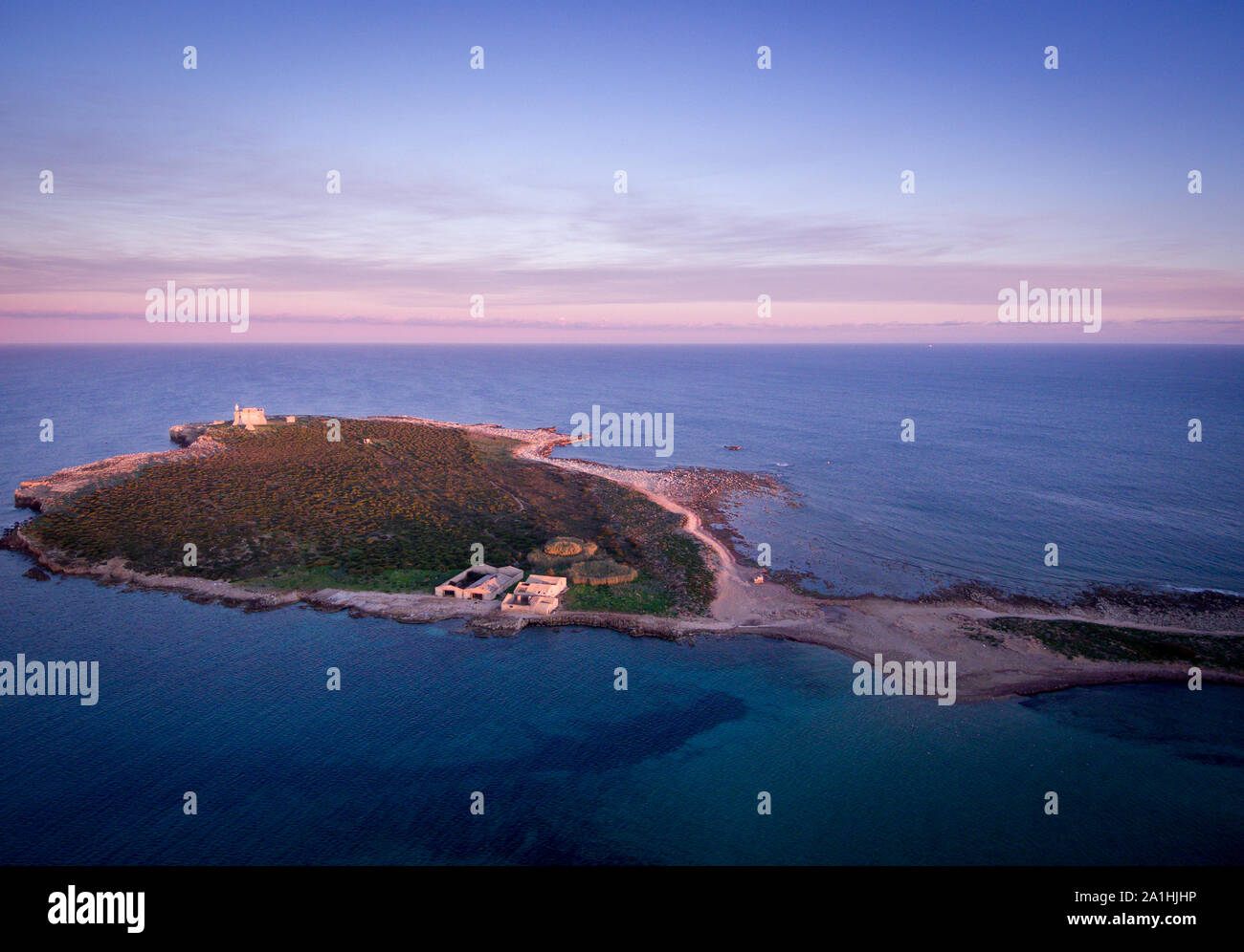 Wonderful aerial view at sunset of the island in front of Portopalo, a town in the south of Sicily. The shot is taken during a beautiful sunny day Stock Photo