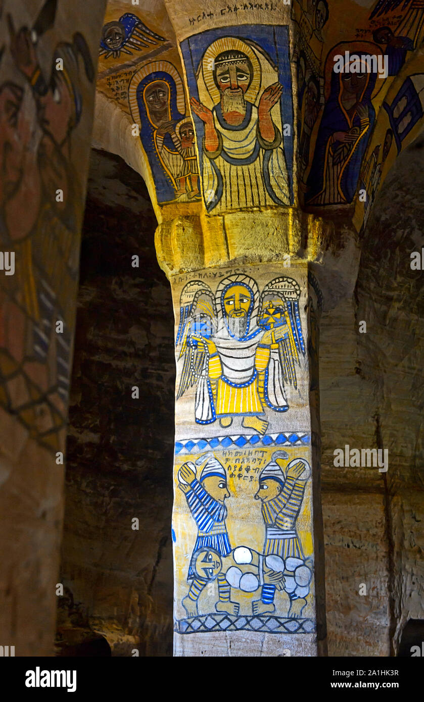 Frescos at the North-west column in the interior of the orthodox rock-hewn church Abuna Gebre Mikael, above: the Ethiopian saint Tekle Haymanot holdin Stock Photo