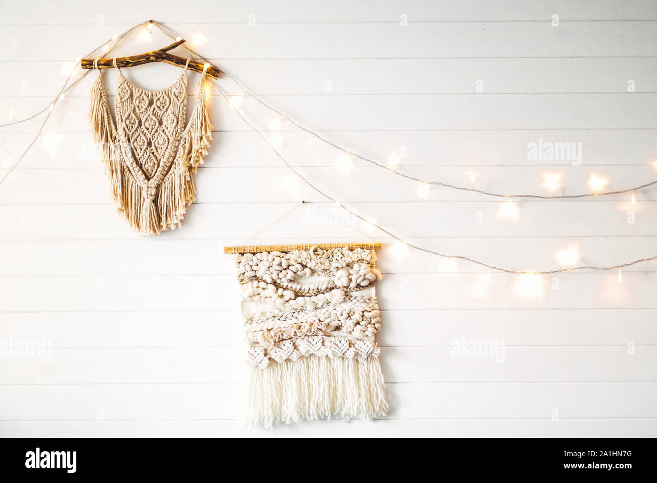 Macrame Hanging On White Wooden Wall With Lights Stylish Boho Decor Modern Wall Hanging Modern Interior Decor In Scandinavian Or Rustic Room Stock Photo Alamy