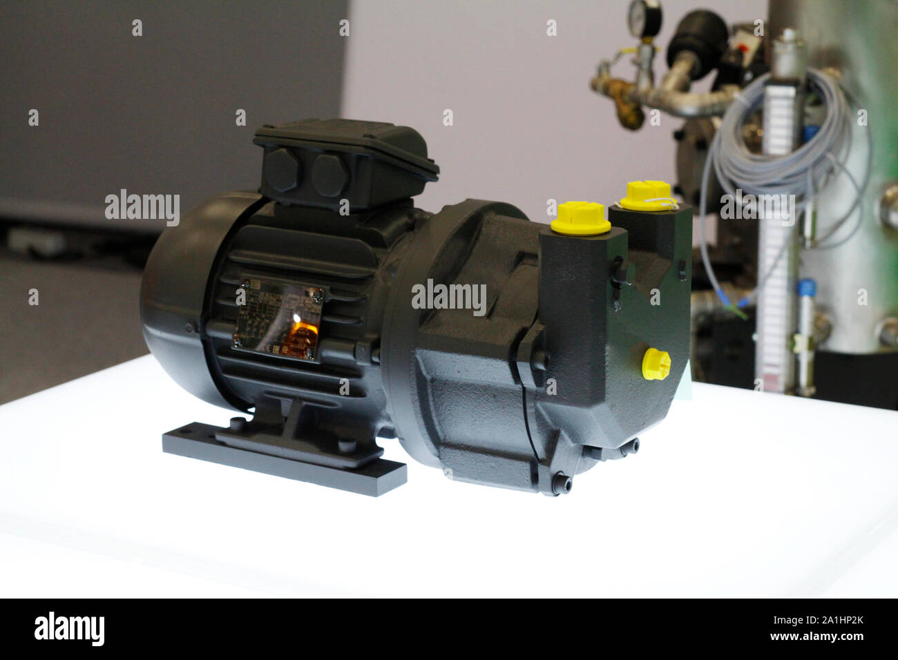Cutaway high vacuum compressor. Vacuum pumps and systems in a manufacturing facility. Vacuum