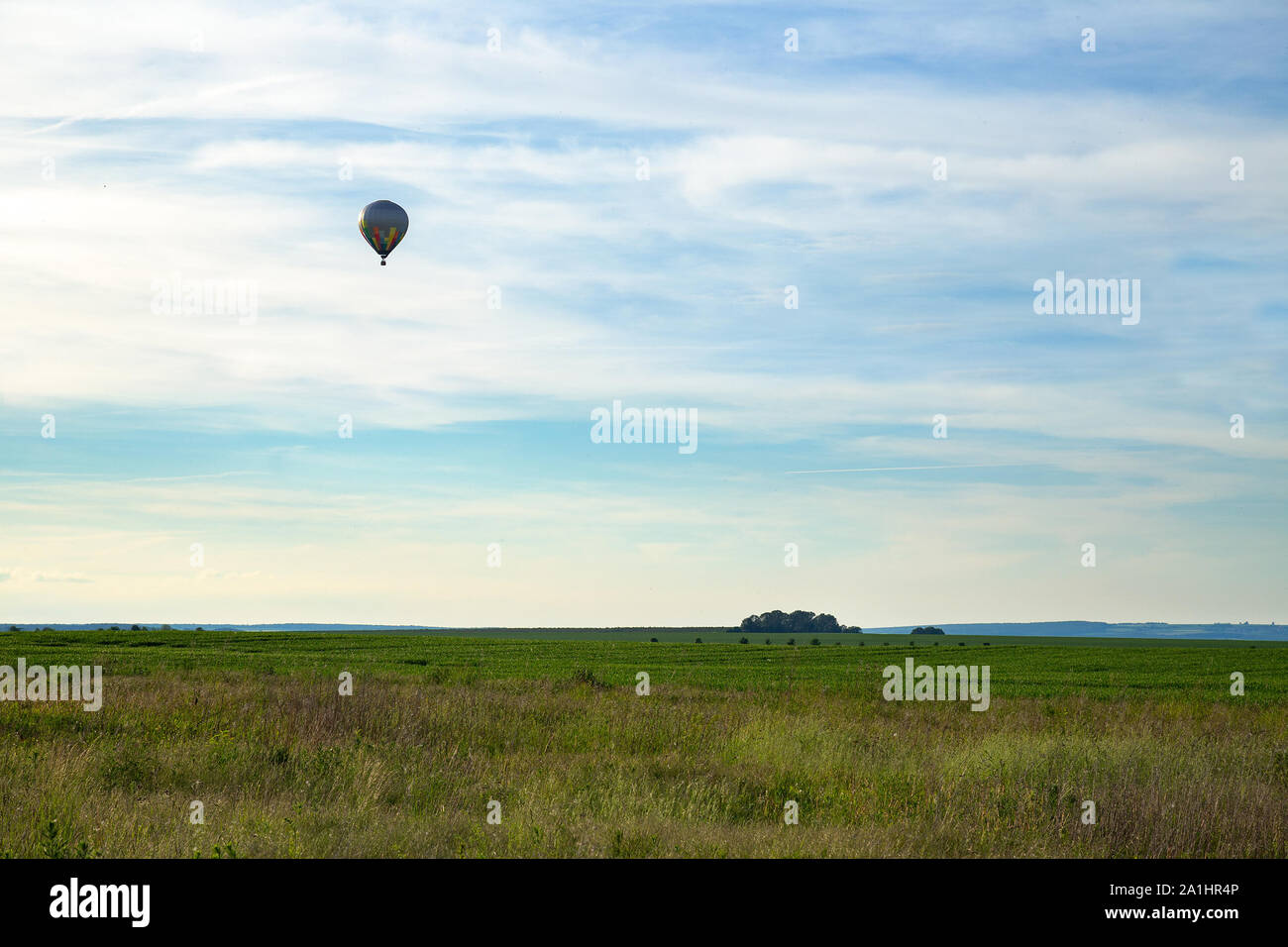 Hot-air balloon over grassland in Thuringia, Germany Stock Photo
