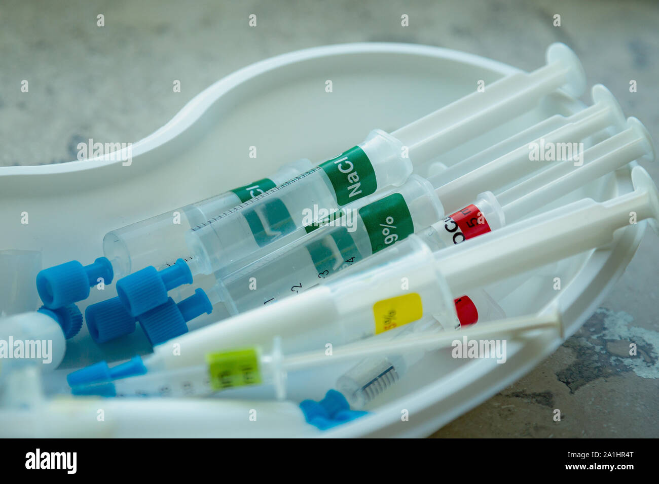 Closeup of several syringes with different medicine and liquids in a