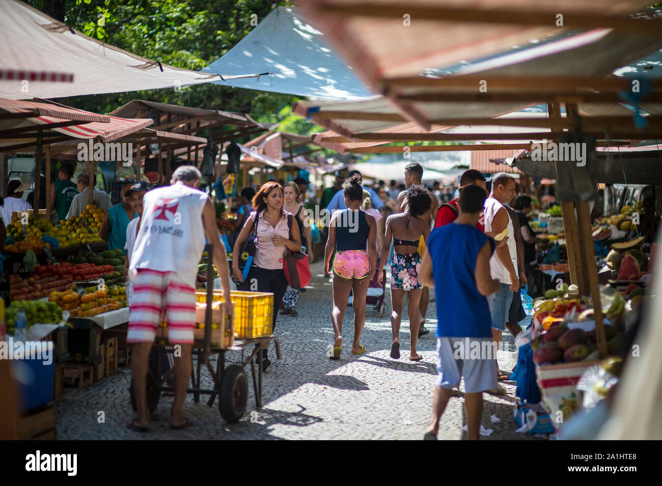 RIO DE JANEIRO - JANUARY 20, 2018: Customers browse the weekly farmer's market for tropical fruits and vegetables in General Osorio Plaza in Ipanema. Stock Photo