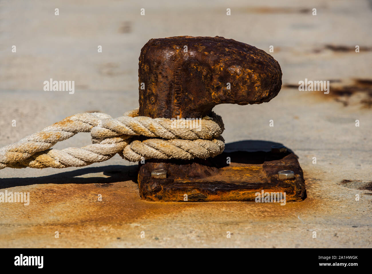 rusty poller on the quaiside Stock Photo