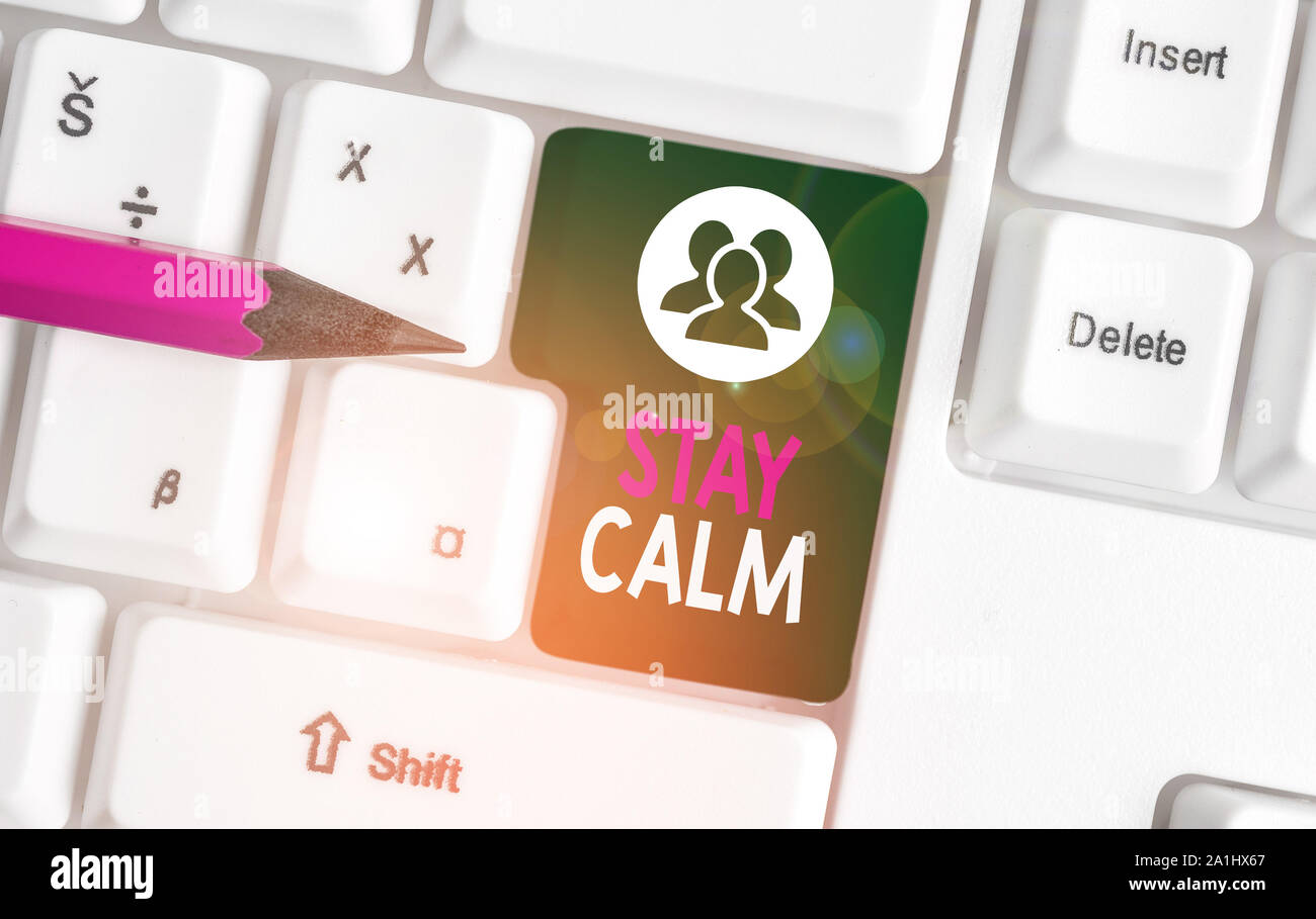 Text sign showing Stay Calm. Business photo text Maintain in a state of motion smoothly even under pressure White pc keyboard with empty note paper ab Stock Photo
