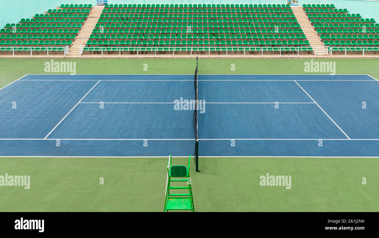 Front view of green surface inside tennis centre stadium Stock Photo