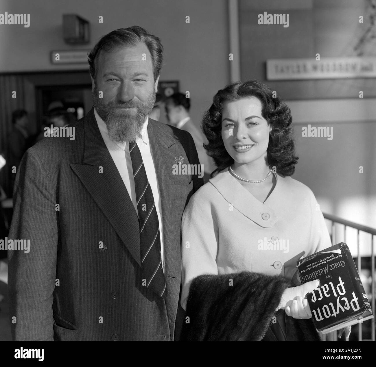 British film stars Anne Heywood and James Robertson Justice on arrival at London Airport from the Cannes Film Festival. Stock Photo