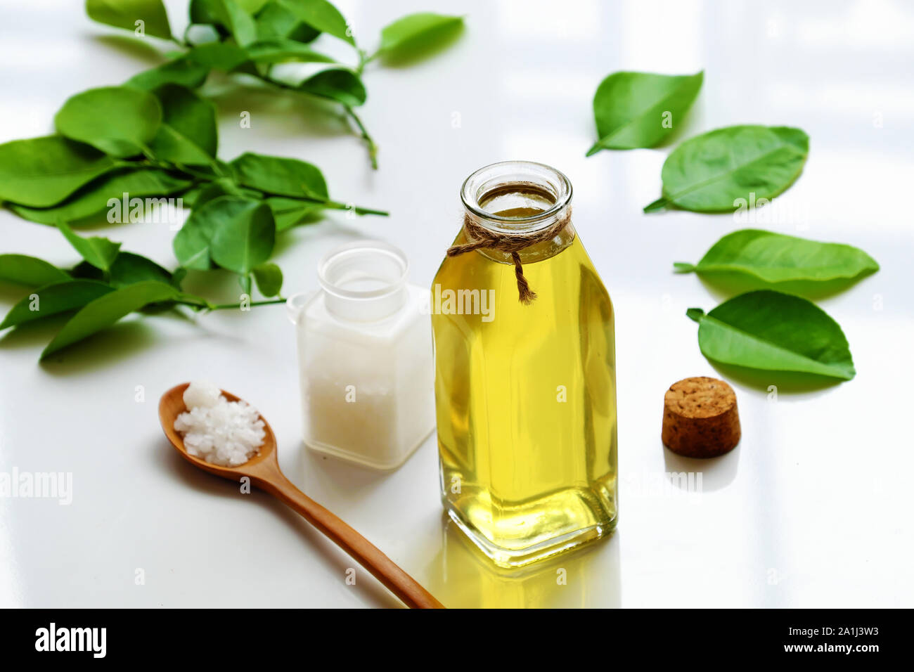 Homemade natural herbal oral care product from lemon leaves, salt boil with water make mouthwash for dental hygiene, treatment bacteria in oral cavity Stock Photo