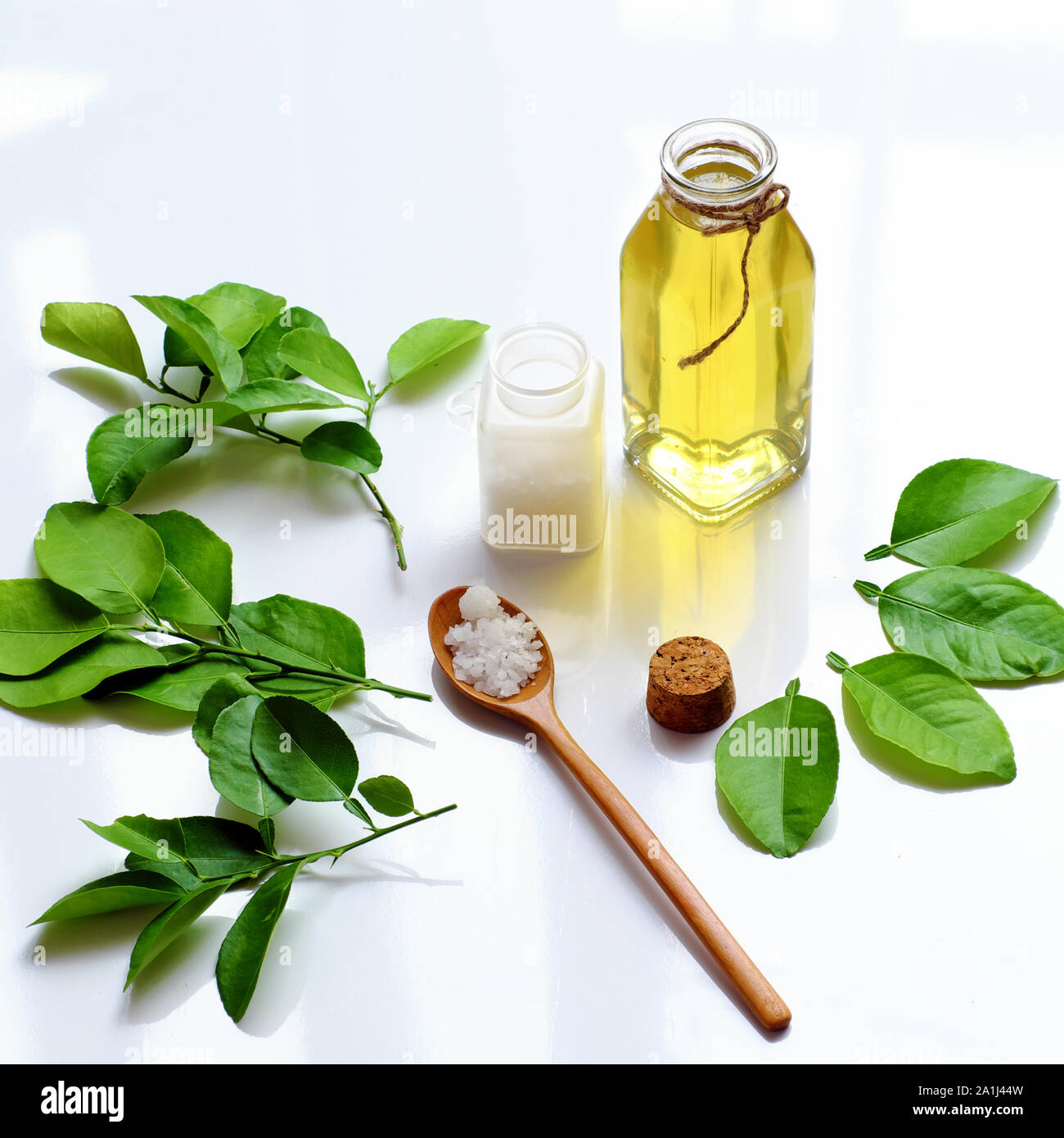 Homemade natural herbal oral care product from lemon leaves, salt boil with water make mouthwash for dental hygiene, treatment bacteria in oral cavity Stock Photo