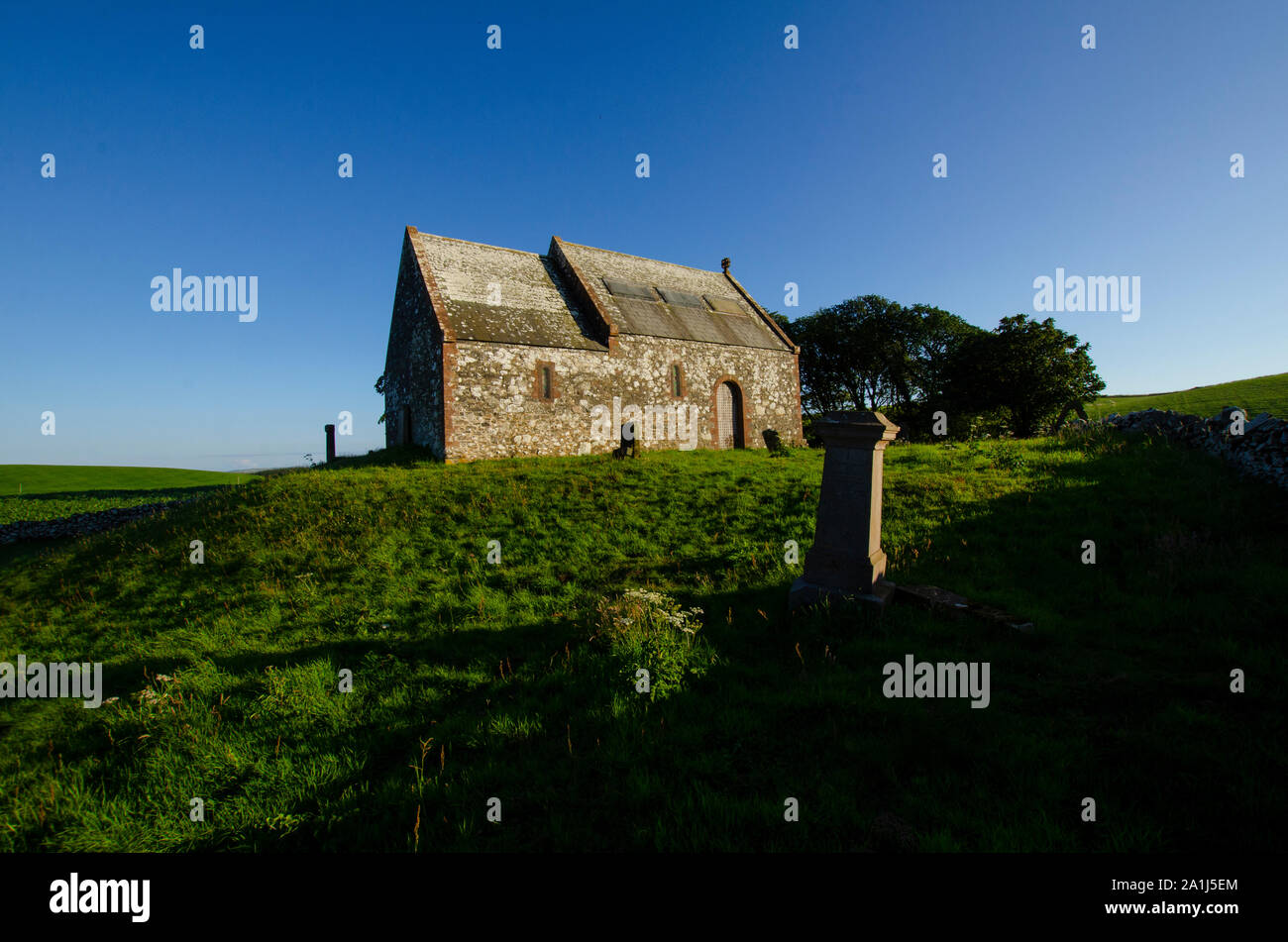 The Kirkmadrine Stones include three of the oldest Christian relics in Scotland reside in this burial chapel at Kirkmadrine Mull of Galloway Scotland Stock Photo