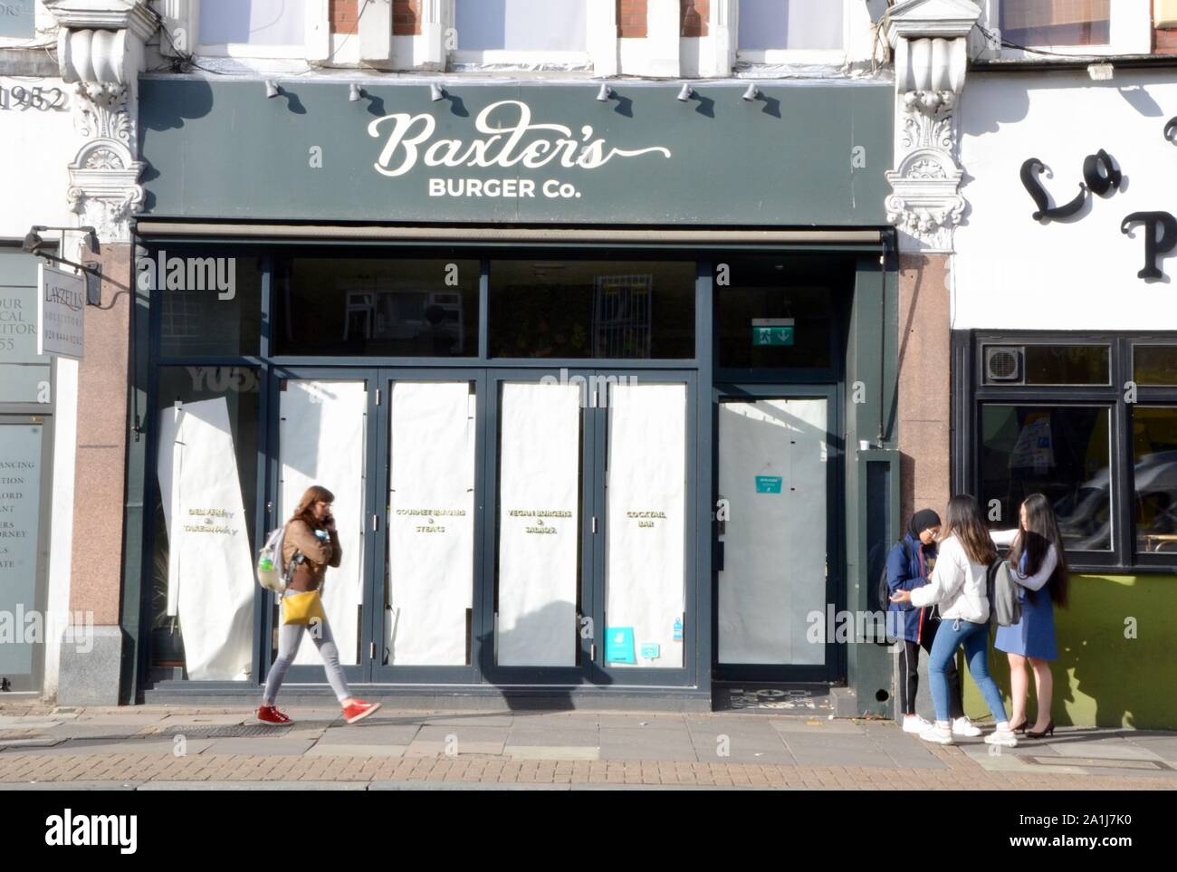 empty and closed down businesses and shops in north london england UK baxters burgers Stock