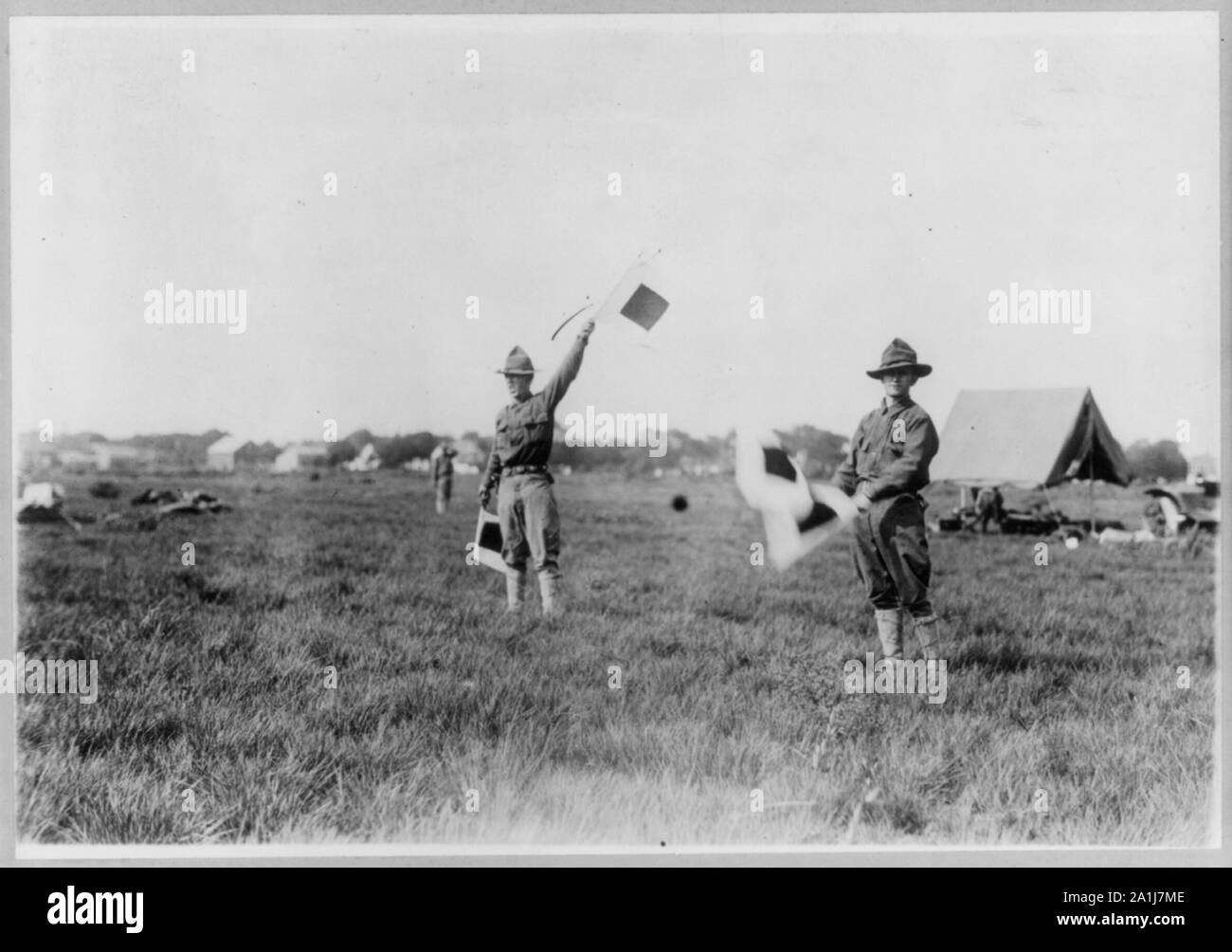 N.Y. National Guard training and maneuvers at Fishkill and Peekskill, N.Y.: 2 soldiers signalling with flags Stock Photo