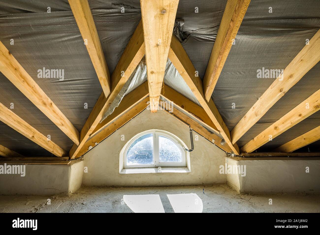 Attic Of A Building With Wooden Beams Of A Roof Structure And A