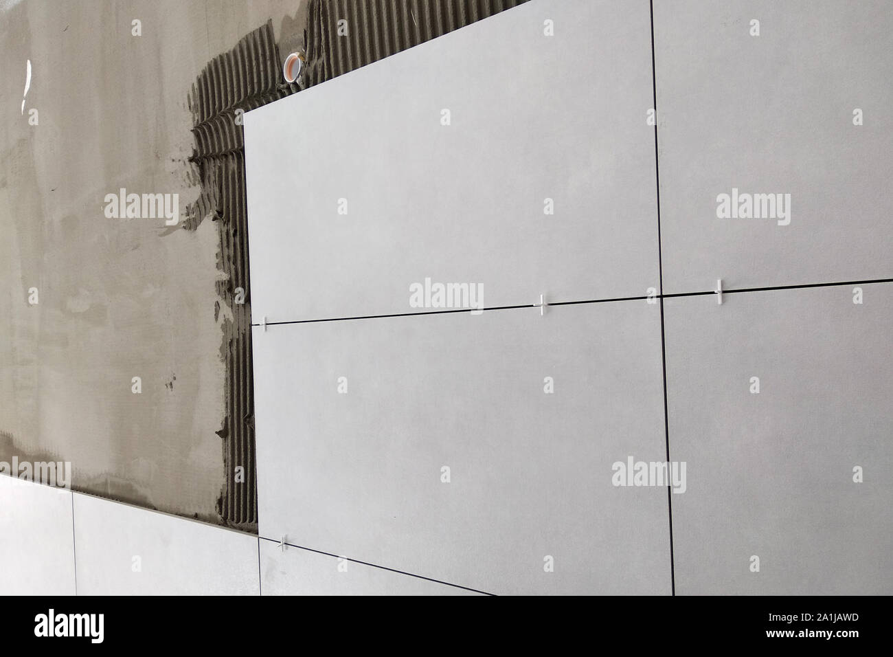 Wall ceramic tiles installation on mortar glue Stock Photo Alamy
