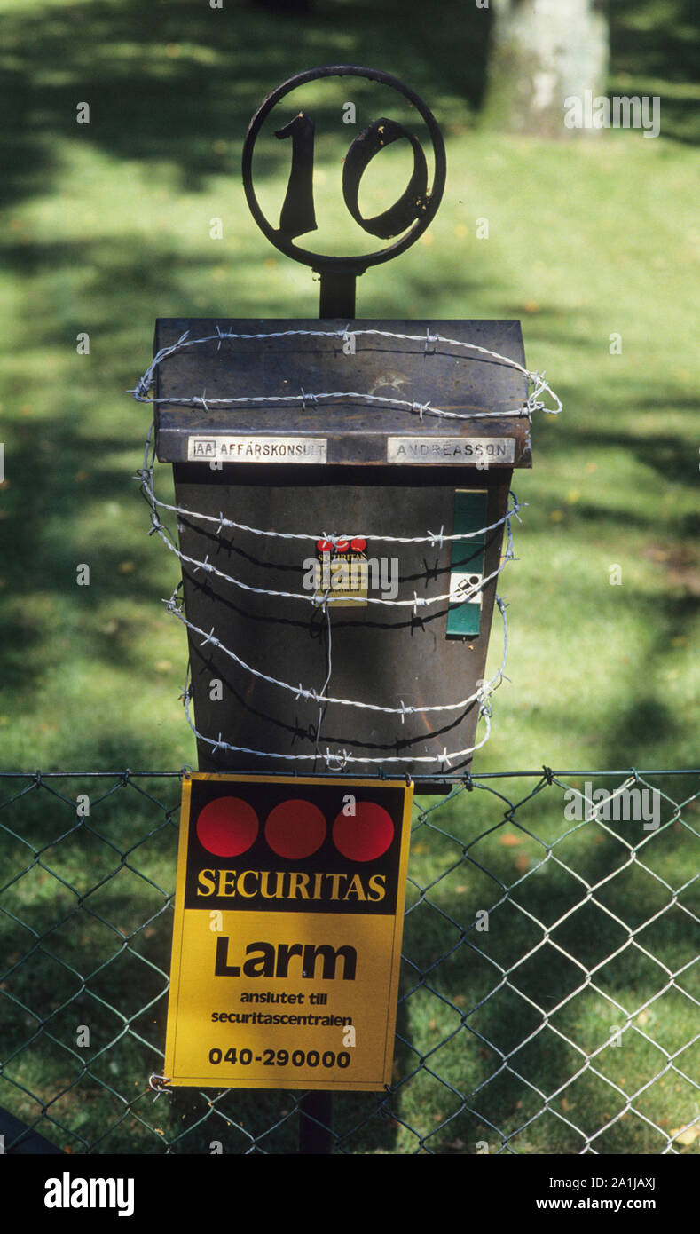 PROTECTED MAILBOX in Skåne labels from security company  and barbed wire Stock Photo