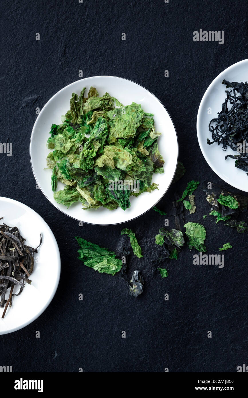 Various dry seaweed, sea vegetables, shot from the top on a dark background with a place for text Stock Photo