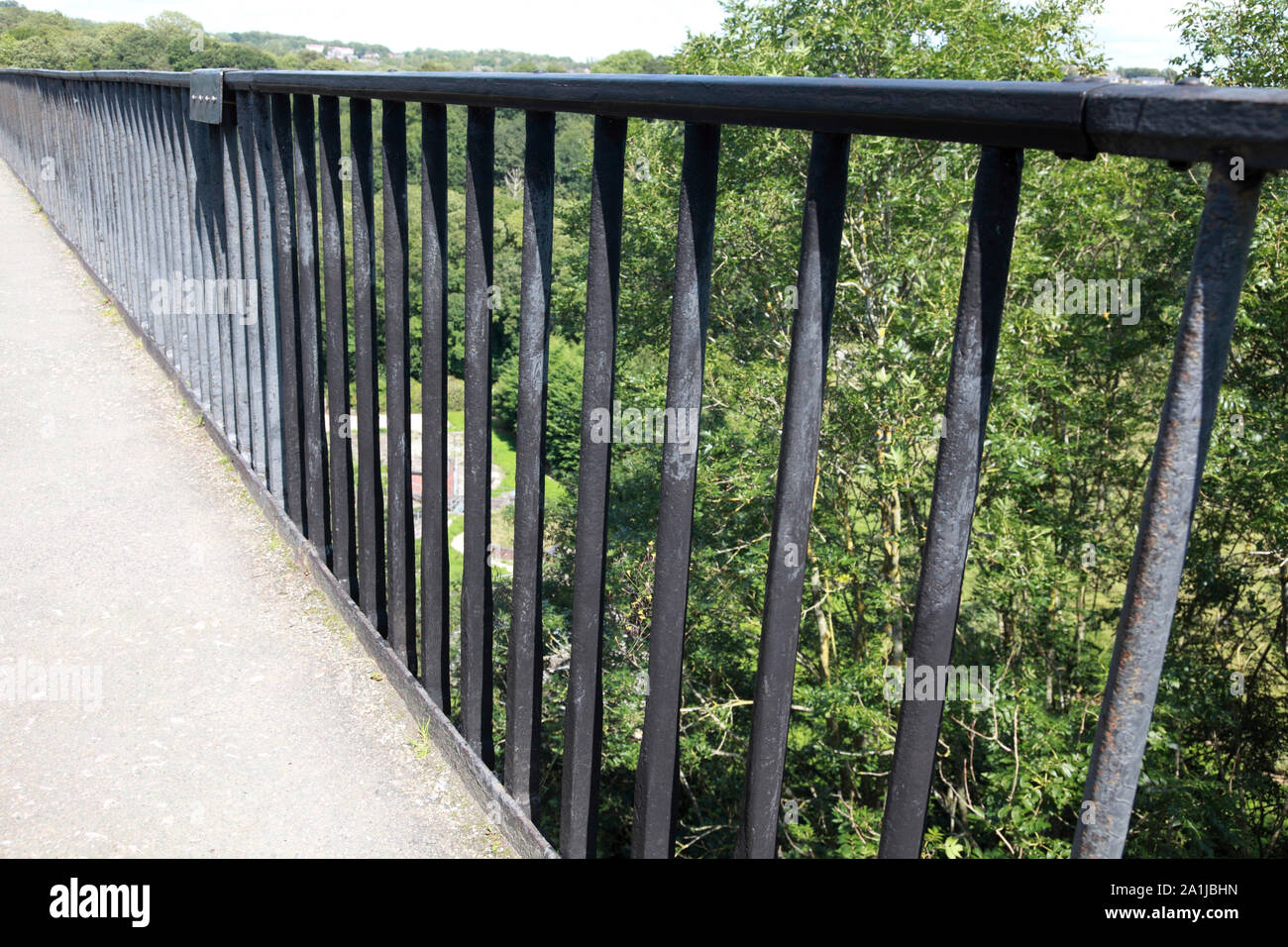 The railing next to the towpath on Pontcysyllte Aqueduct which carries the Llangollen Canal over the river Dee in north Wales Stock Photo