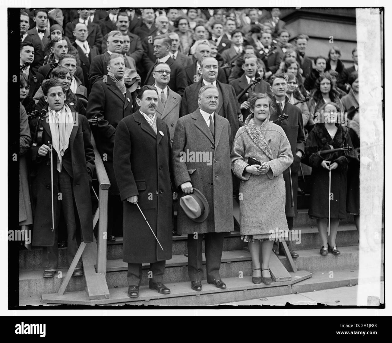 National High School Orchestra with President Herbert Hoover, and Joe Maddy (to left of the president,) in front of the State, War and Navy Building, Washington, D.C. Stock Photo