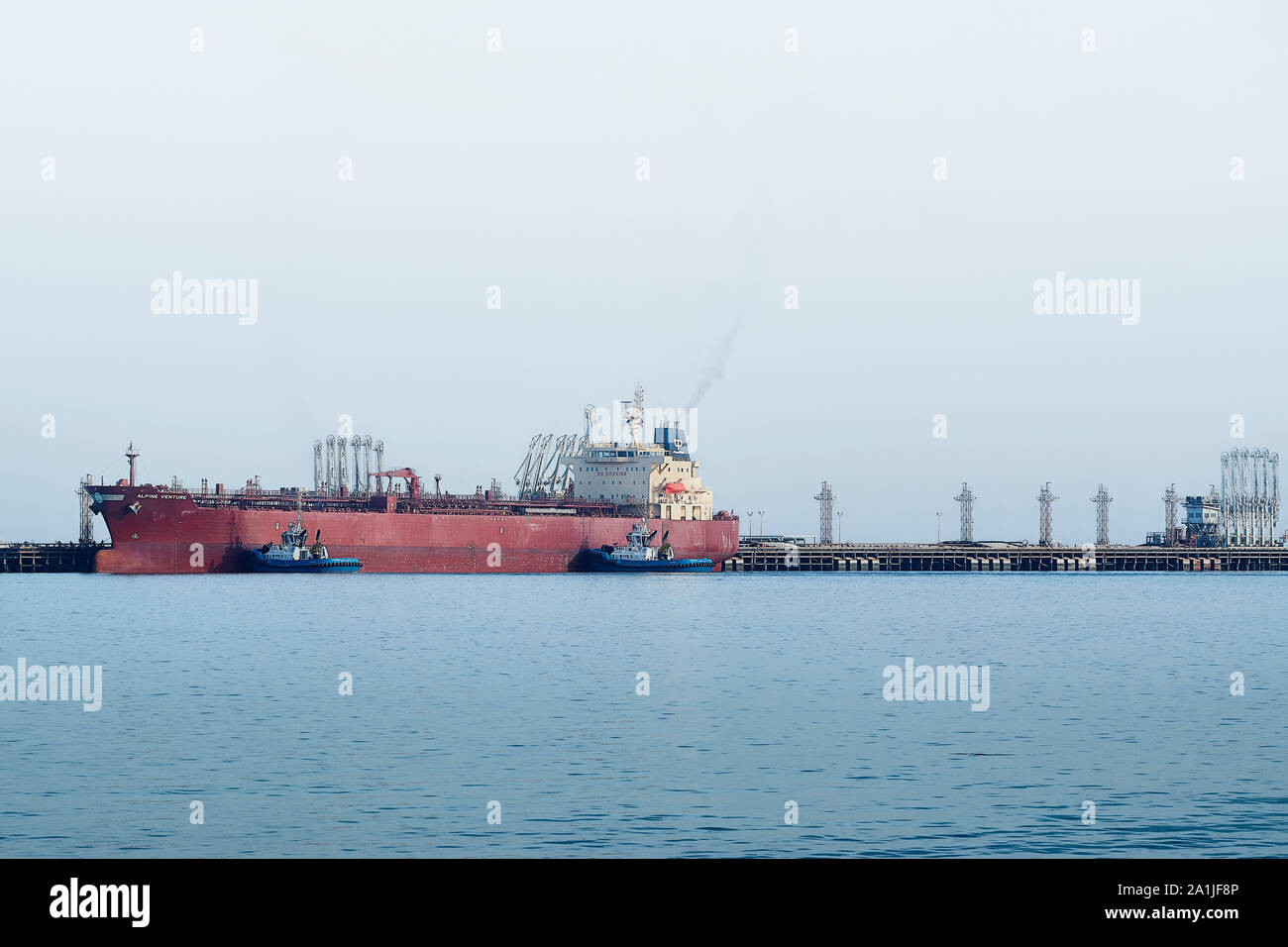 The Alpine Venture oil tanker which is registered in the Marshall Islands  is in the Kuwait city port to load oil for transport. Stock Photo