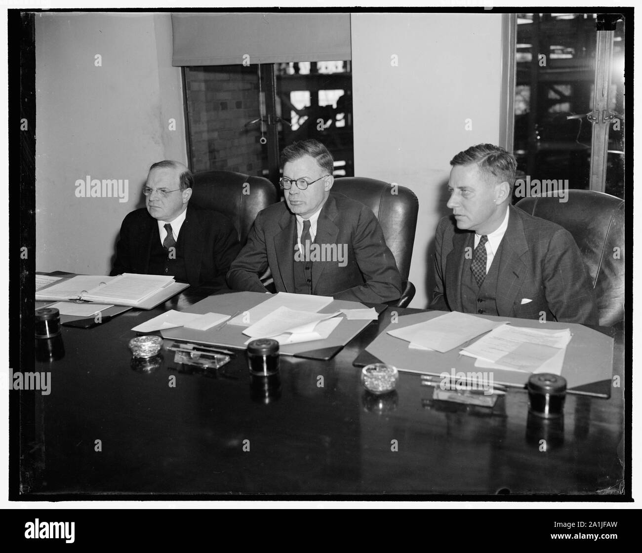 National Labor Relations Board. Washington, D.C., Dec. 22. The National Labor Relations Board, now being investigated by a Special House Committee, were snapped in this new informal picture during a hearing today. Left to right: William M. Leiserson, J. Warren Madden, Chairman, and Edwin S. Smith Stock Photo