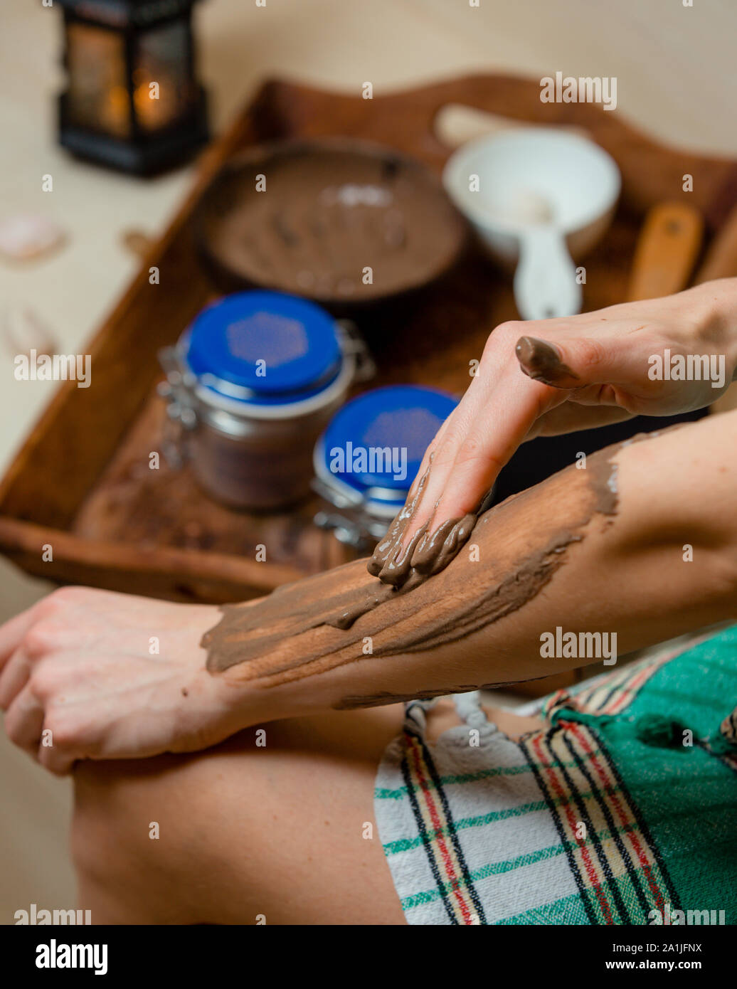 Beautician applying face clay mask hi-res stock photography and images ...