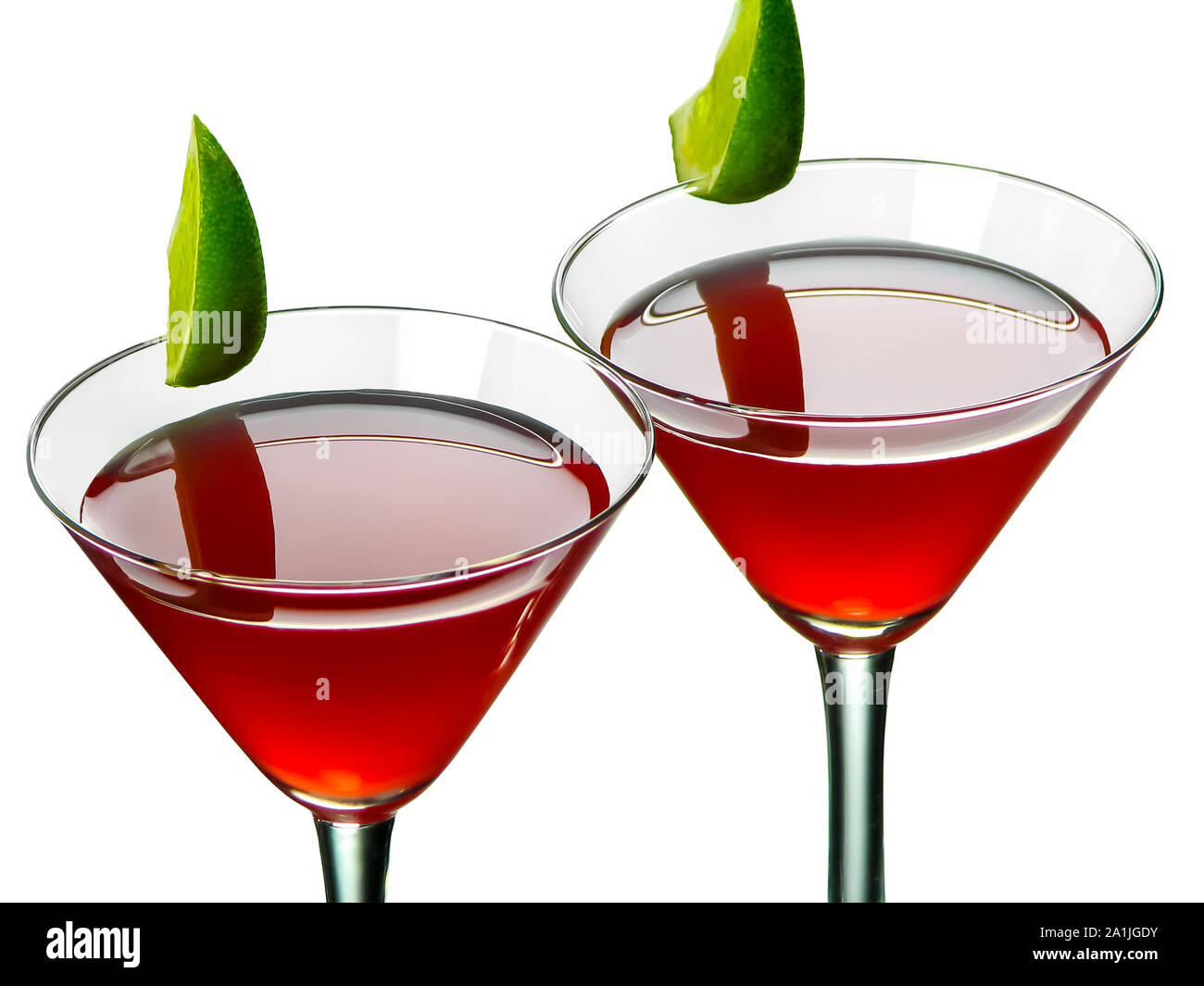 Bright red Bacardi alcoholic cocktail made of white rum, lime juice and grenadine, in two conical cocktail glasses decorated with lime slices Stock Photo
