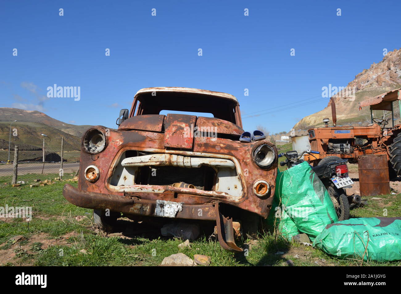 Old Vehicles Images for old and worn out car.Images for old and worn out car.اThis car is located in the highlands around Qazvin in Iran. Stock Photo