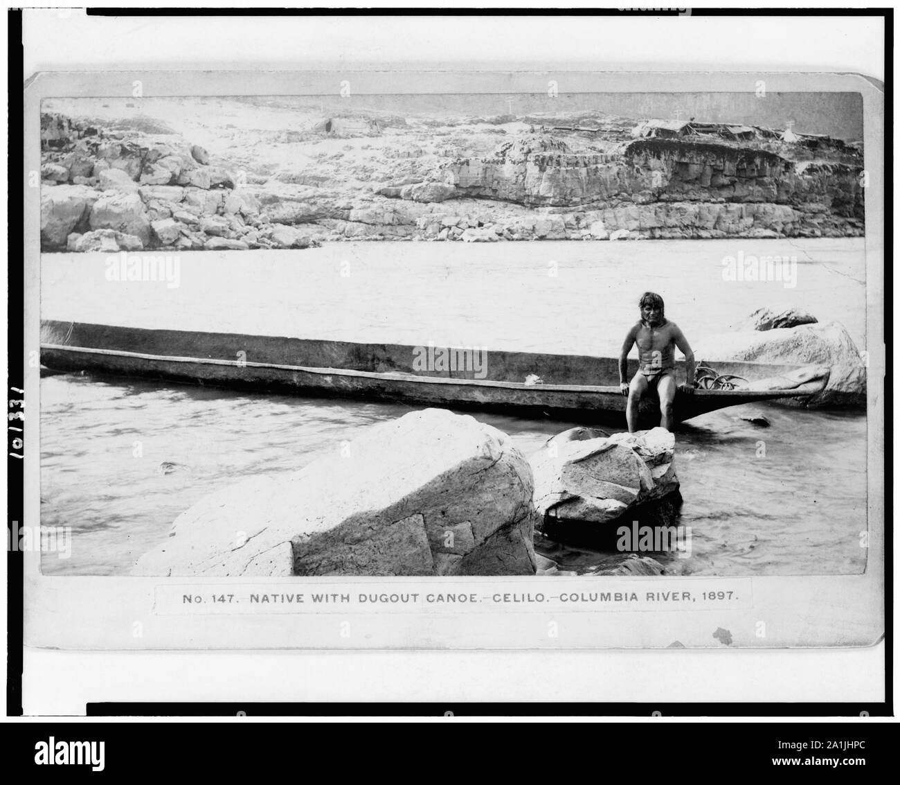 Native with dugout canoe-Celilo-Columbia River, 1897 / [Gi]fford, The Dalles, Or. Stock Photo